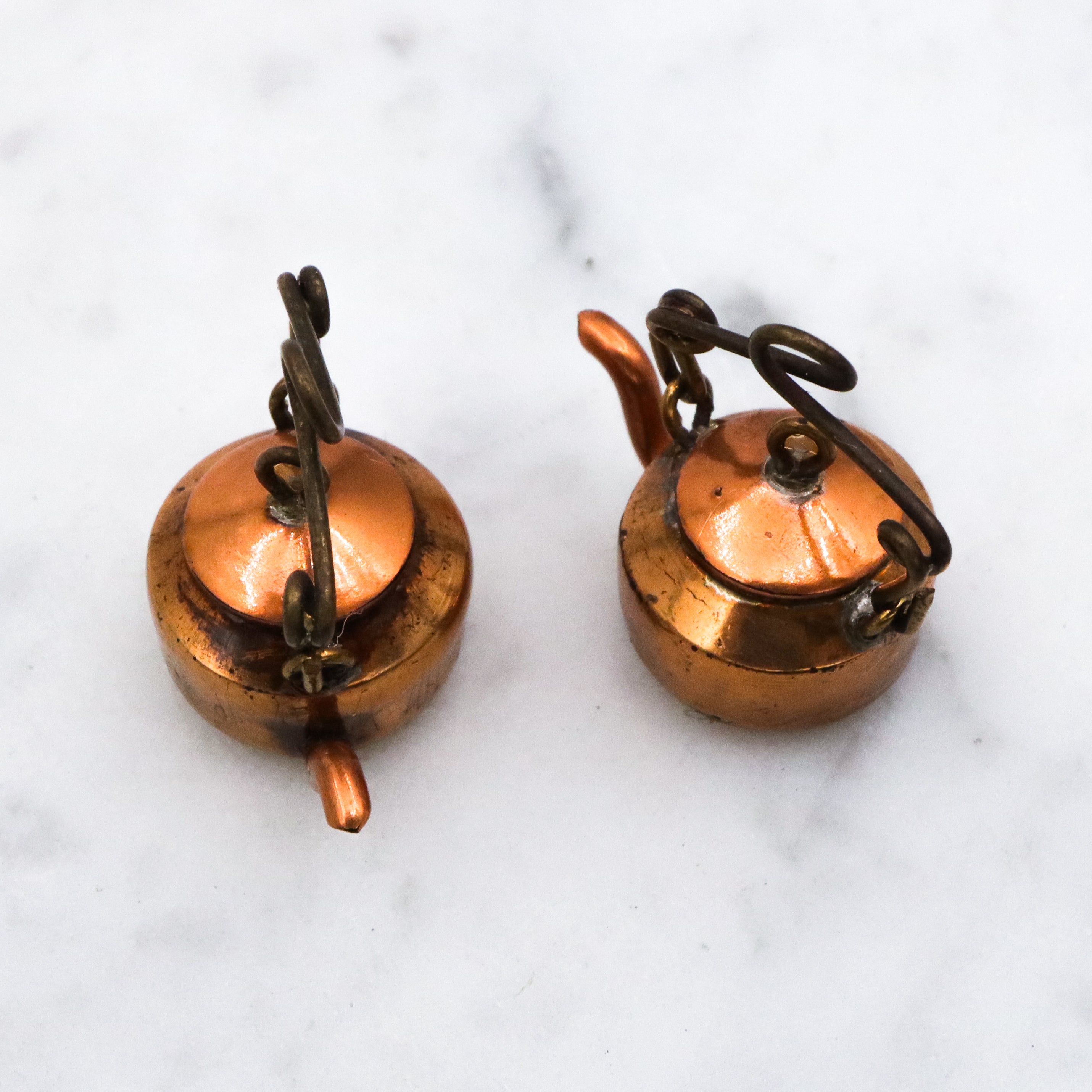 Pair of antique early 20th century prisoner made wheat penny copper tea kettles